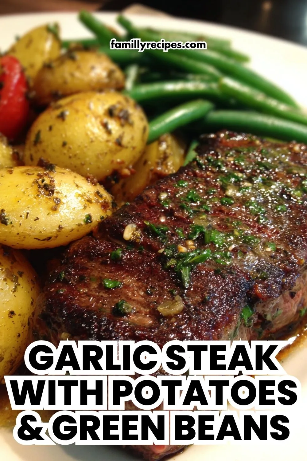 A plate showing a complete meal of Garlic Steak with Potatoes and Green Beans.