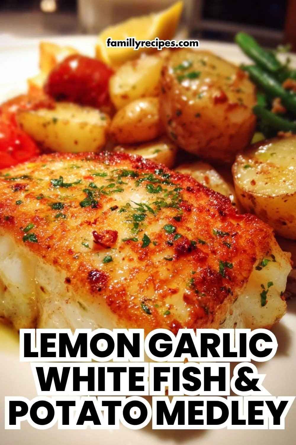 A flaky baked white fish fillet with roasted potatoes on a sheet pan