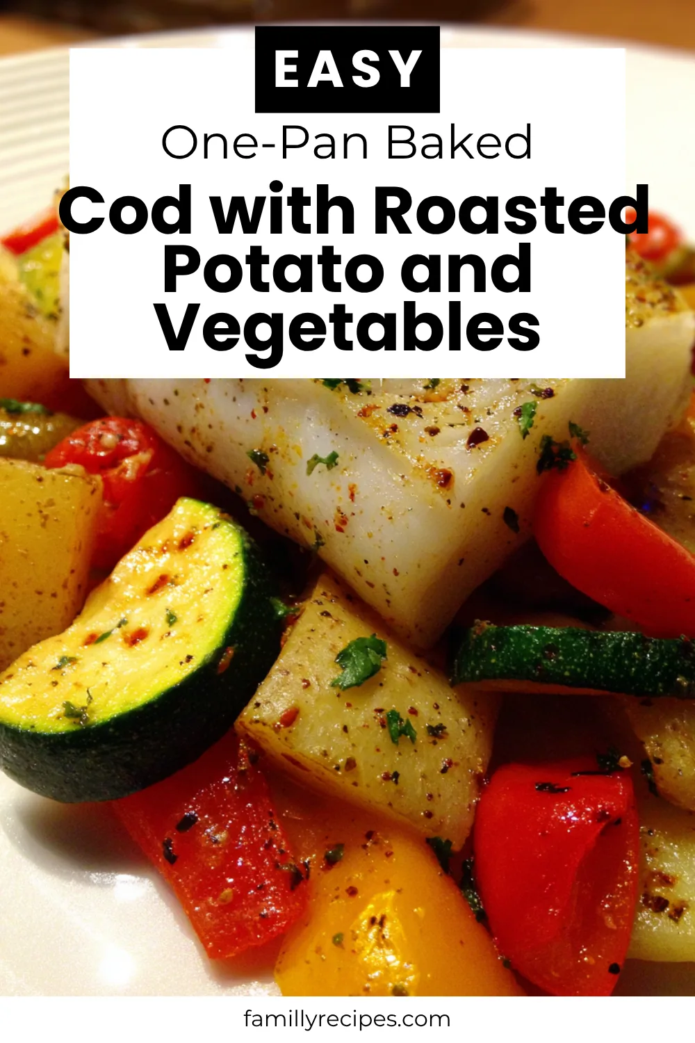 Flaky oven-baked cod fillet with golden roasted potatoes and colorful veggies—one-pan family dinner