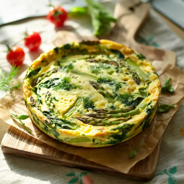 Easy spring brunch frittata with asparagus and spinach baked until set and golden